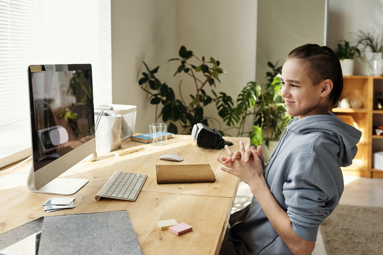 Student with Apple iMac