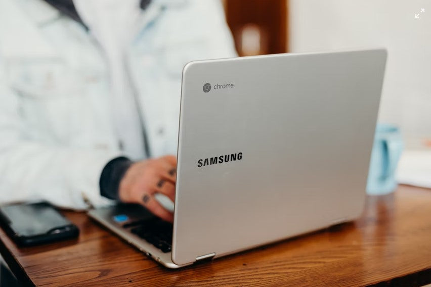 Student typing on Samsung Chromebook